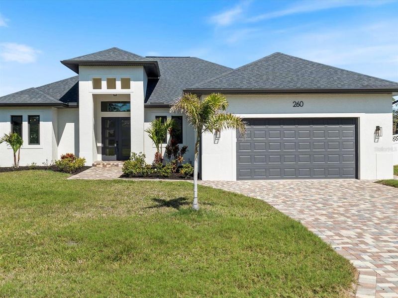 Front exterior of a new home in , Rotonda West, FL, highlighting curb appeal (Image 1). Front exterior of a new home in , Rotonda West, FL, highlighting curb appeal (Image 1).
