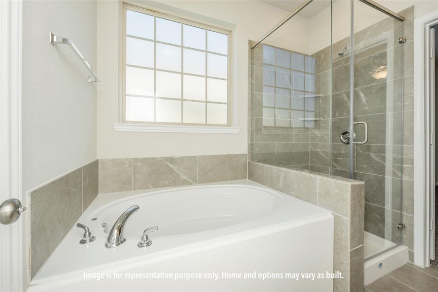 Full bath with a stall shower and a garden tub