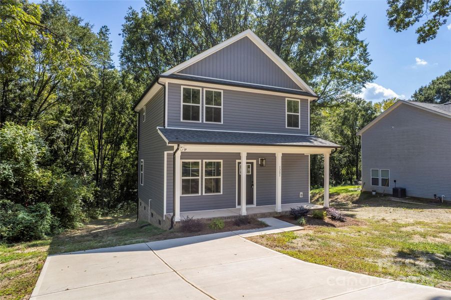 Front exterior of a new home in , Gastonia, NC, highlighting curb appeal (Image 15).