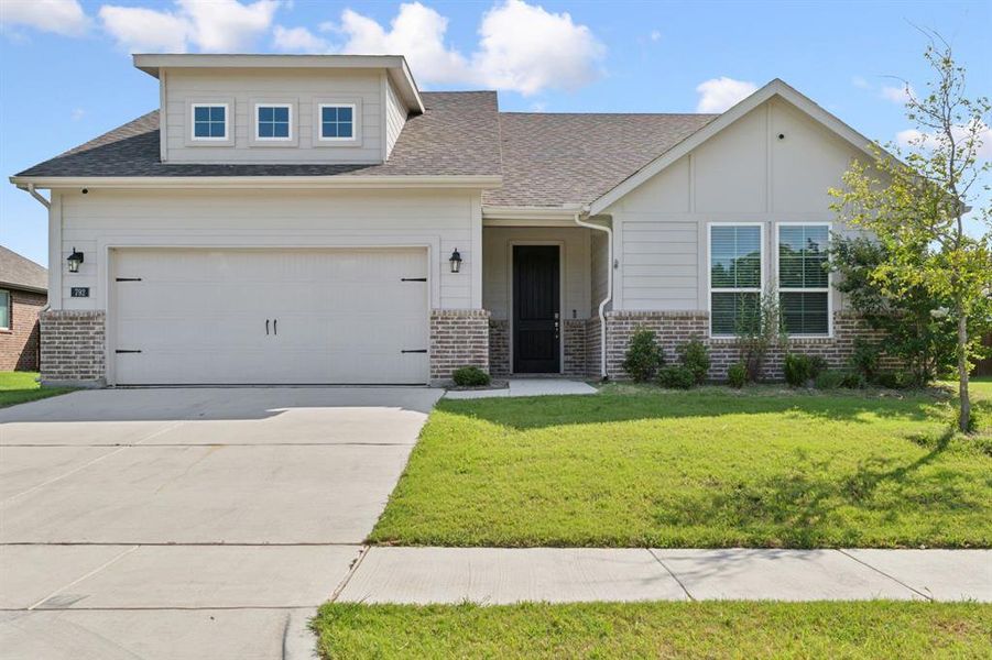 Front exterior of a new home in Holbrook Farm, Springtown, TX, highlighting curb appeal (Image 2). Front exterior of a new home in Holbrook Farm, Springtown, TX, highlighting curb appeal (Image 2).