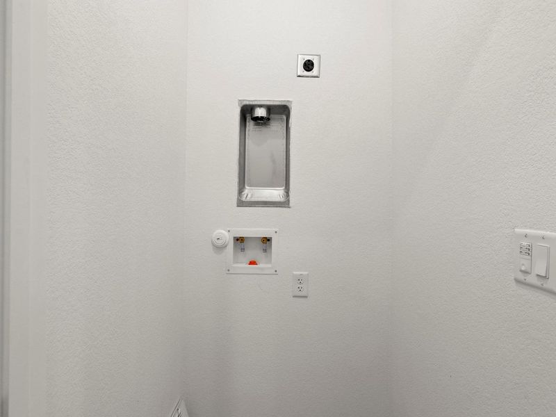 Ready for appliances, this dedicated space offers convenient utility hookups.