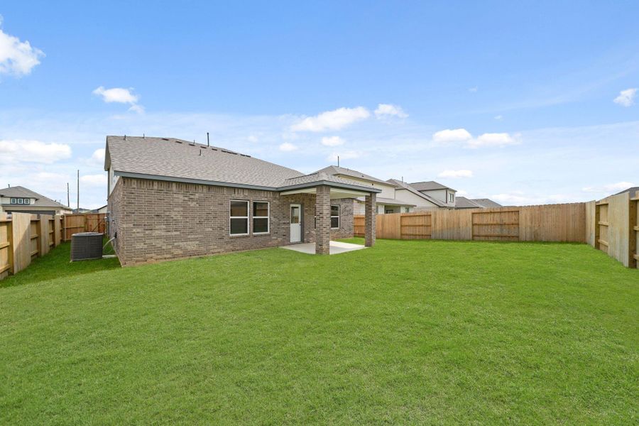 Exterior details and patio area of a home in Sunterra, Katy (Image 3).
