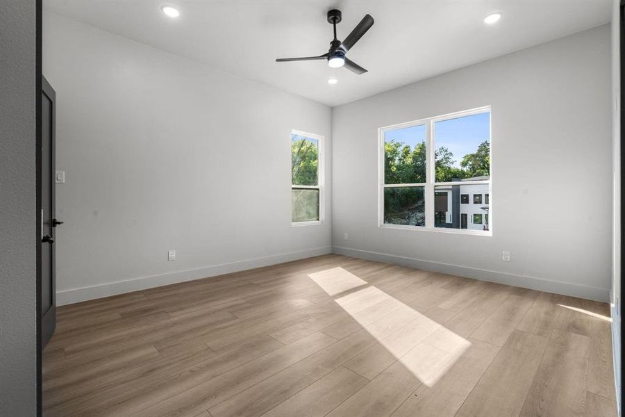 Unfurnished room with light wood-style floors, recessed lighting, and a ceiling fan