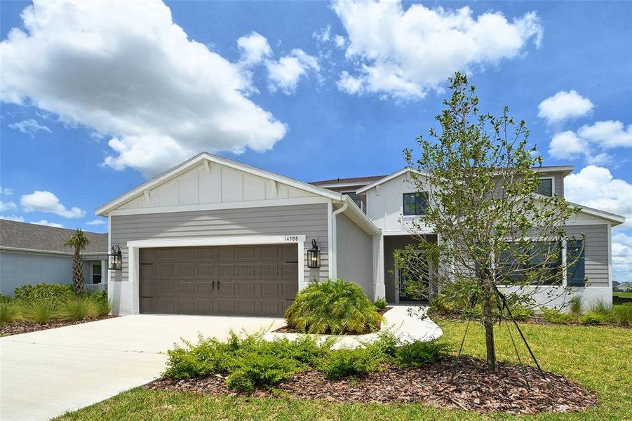Front exterior of a new home in Canoe Creek, Parrish, FL, highlighting curb appeal (Image 25).