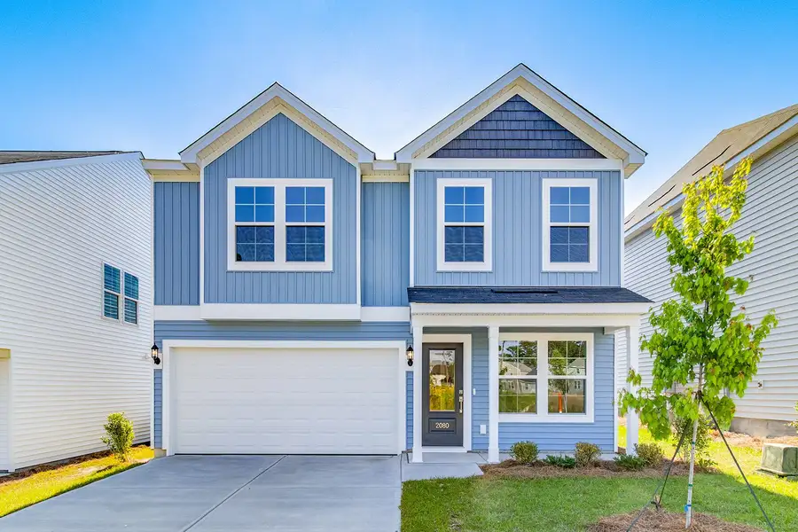 Front exterior of a new home in Ellington, Elgin, SC, highlighting curb appeal (Image 1). Front exterior of a new home in Ellington, Elgin, SC, highlighting curb appeal (Image 1).