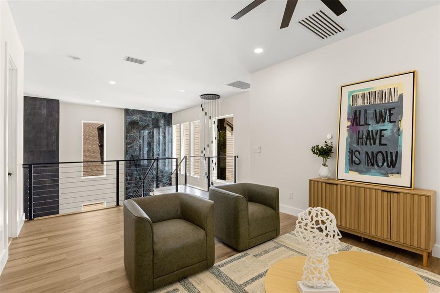 Loft space featuring wood-finish flooring, vaulted ceilings, and recessed lighting