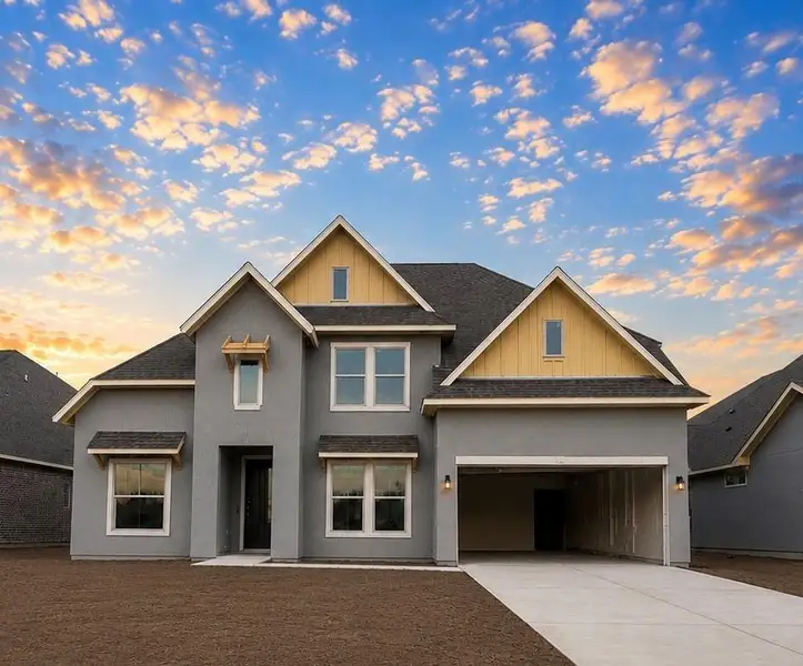 Front exterior of a new home in The Meadows at Imperial Oaks, Spring, TX, highlighting curb appeal (Image 1). Front exterior of a new home in The Meadows at Imperial Oaks, Spring, TX, highlighting curb appeal (Image 1).