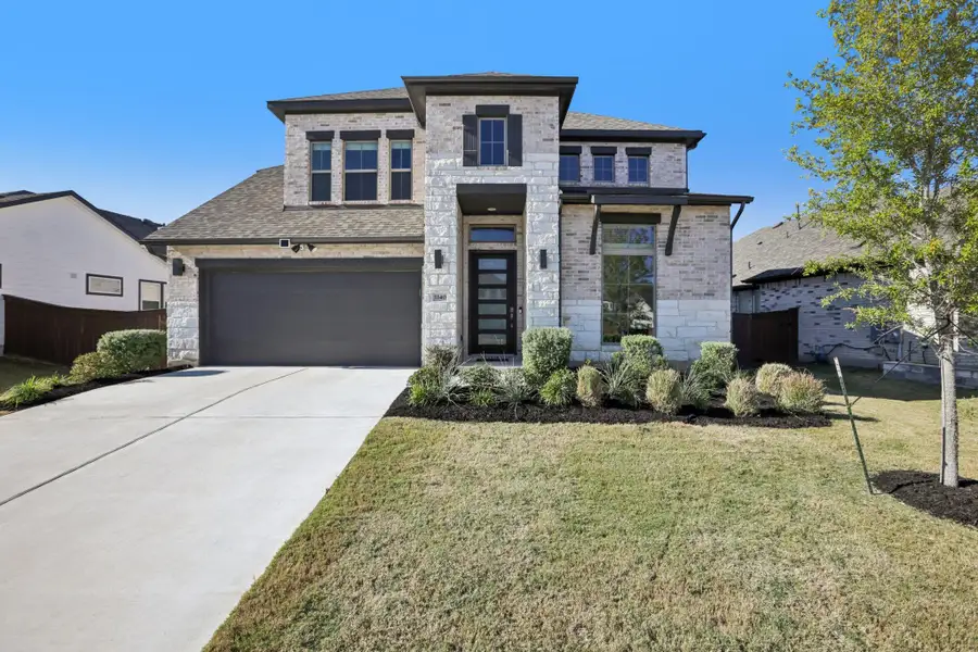 Front exterior of a new home in , Leander, TX, highlighting curb appeal (Image 2).