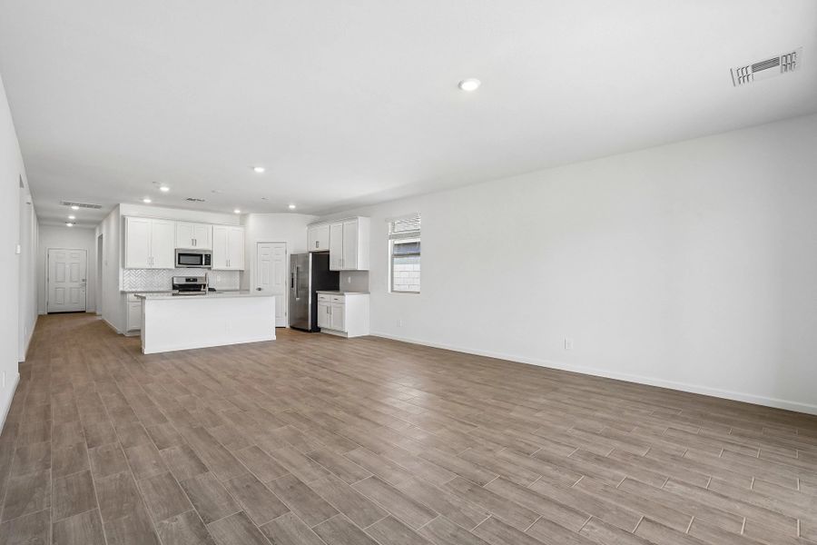 Great room, dining and kitchen Great room, dining and kitchen