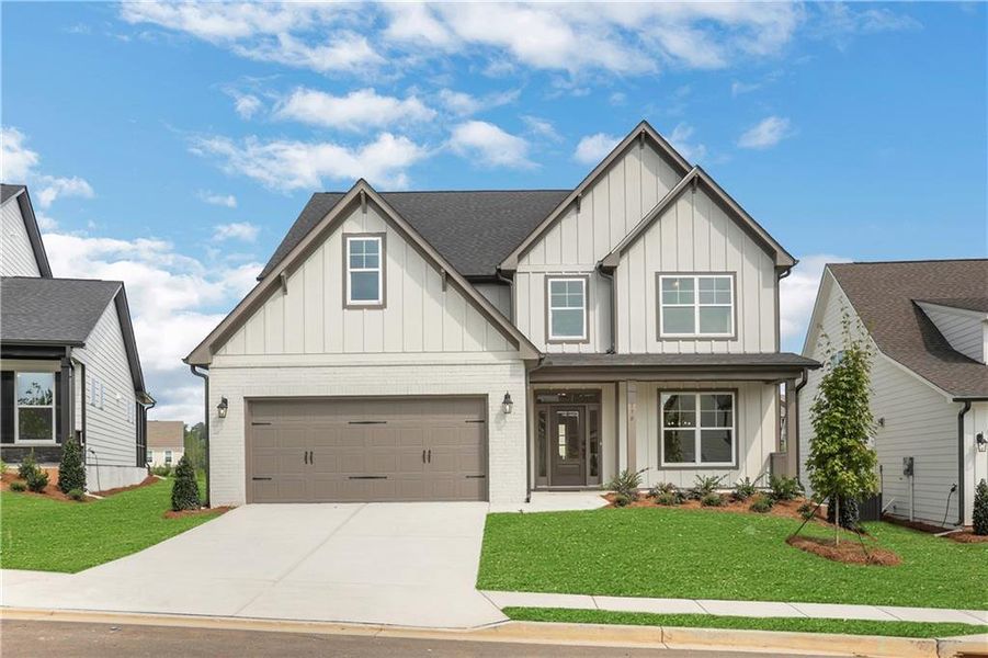 Front exterior of a new home in Twin Lakes, Hoschton, GA, highlighting curb appeal (Image 30).