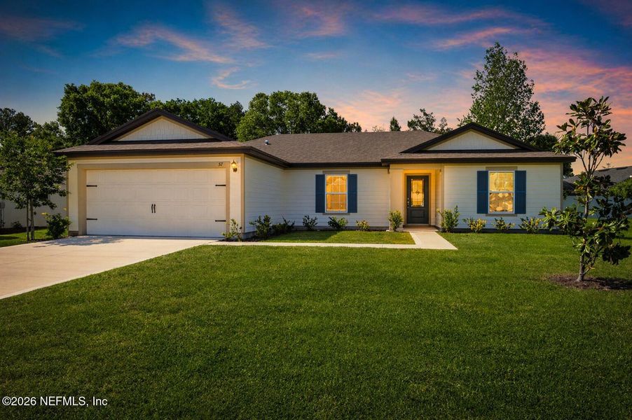 Front exterior of a new home in Palm Coast, Palm Coast, FL, highlighting curb appeal (Image 12). Front exterior of a new home in Palm Coast, Palm Coast, FL, highlighting curb appeal (Image 12).