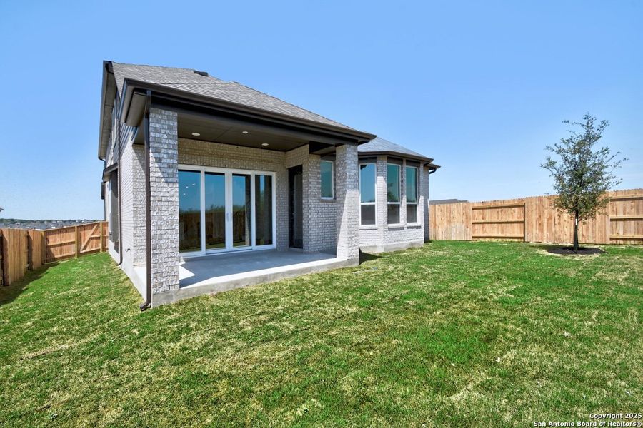 Front exterior of a new home in Homestead, Schertz, TX, highlighting curb appeal (Image 20).