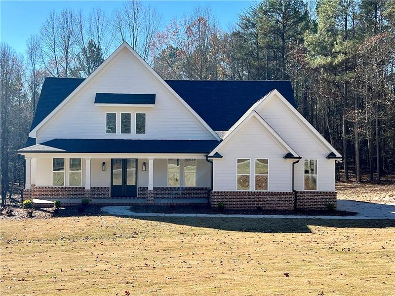 Front exterior of a new home in , Pendergrass, GA, highlighting curb appeal (Image 1).