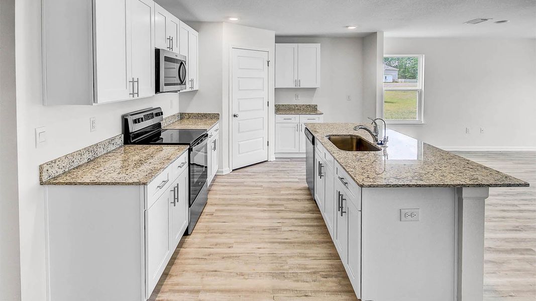 Representative furnished interior of a home built from the Lismore by D.R. Horton in Owl's Head Farms, Freeport (Image 8).