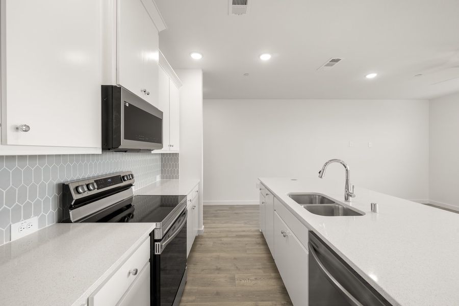 Furnished interior view inside a new home in Wildridge, Oak Point (Image 7).