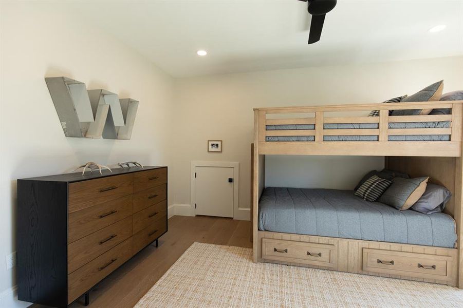 Bedroom with dark wood-style floors, recessed lighting, and ceiling fan