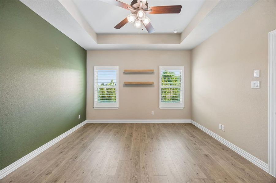 This primary suite is captivating. It has open shelving on the walls with an ensuite bath. This primary suite is captivating. It has open shelving on the walls with an ensuite bath.