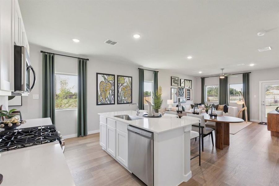 Kitchen in the Magnolia home plan by Trophy Signature Homes – REPRESENTATIVE PHOTO