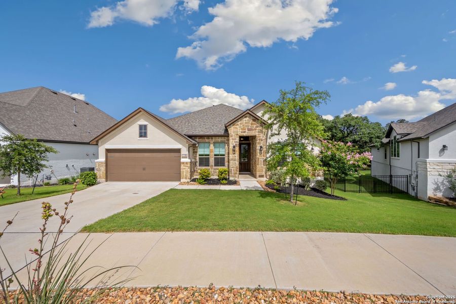 Front exterior of a new home in Esperanza - 70', Boerne, TX, highlighting curb appeal (Image 20). Front exterior of a new home in Esperanza - 70', Boerne, TX, highlighting curb appeal (Image 20).