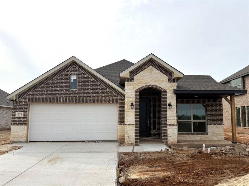 Front exterior of a new home in El Dorado, Granbury, TX, highlighting curb appeal (Image 1). Front exterior of a new home in El Dorado, Granbury, TX, highlighting curb appeal (Image 1).