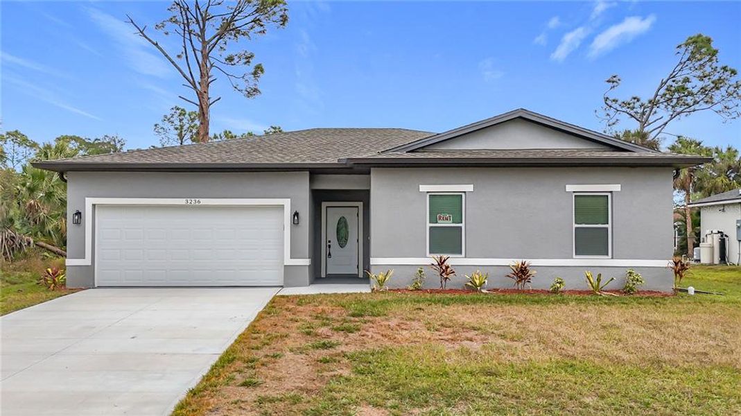 Front exterior of a new home in , North Port, FL, highlighting curb appeal (Image 1). Front exterior of a new home in , North Port, FL, highlighting curb appeal (Image 1).