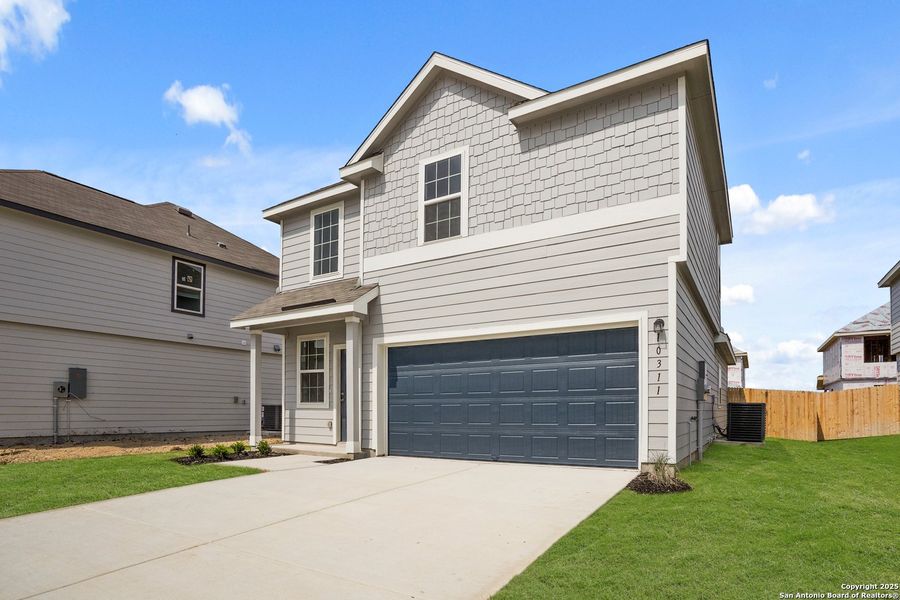 Front exterior of a new home in Applewhite Meadows, San Antonio, TX, highlighting curb appeal (Image 1). Front exterior of a new home in Applewhite Meadows, San Antonio, TX, highlighting curb appeal (Image 1).