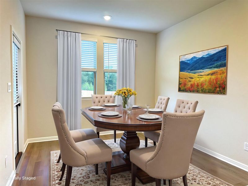 Dining room with LVP floors, baseboards, and recessed lighting