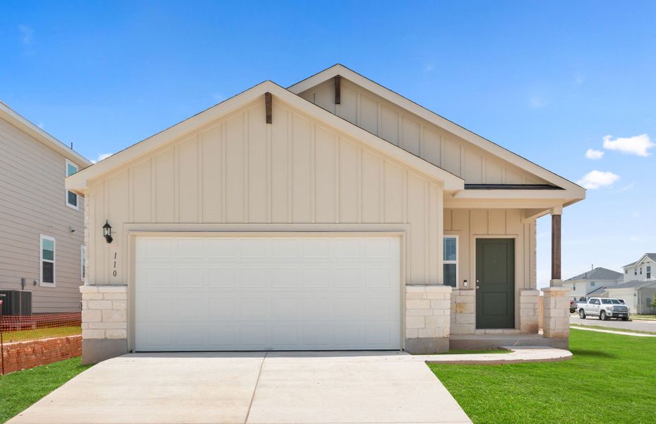 Front exterior of a new home in Sunfield, Buda, TX, highlighting curb appeal (Image 20). Front exterior of a new home in Sunfield, Buda, TX, highlighting curb appeal (Image 20).
