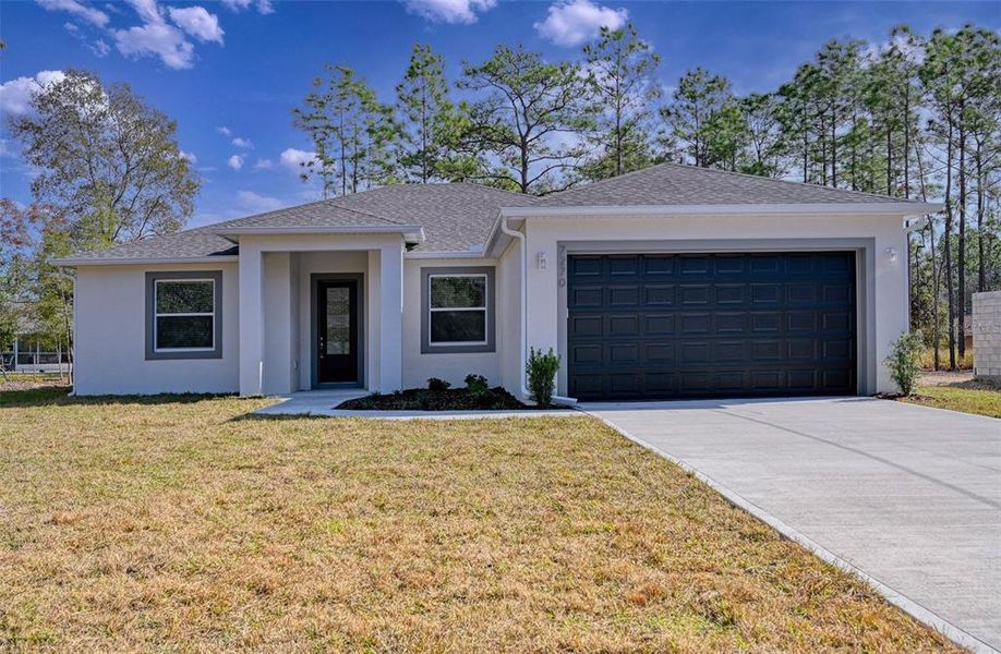 Front exterior of a new home in , Citrus Springs, FL, highlighting curb appeal (Image 21).