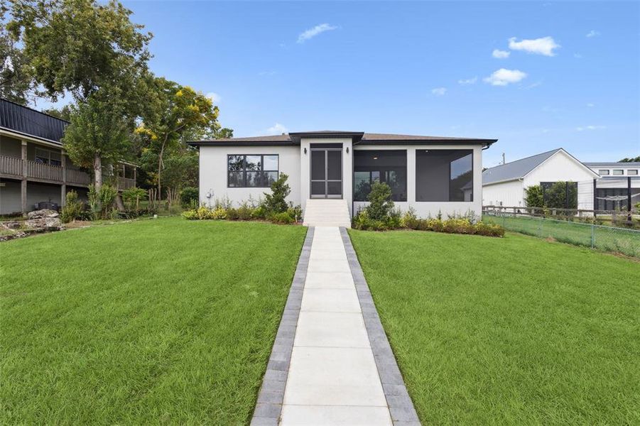 Front exterior of a new home in , Montverde, FL, highlighting curb appeal (Image 23). Front exterior of a new home in , Montverde, FL, highlighting curb appeal (Image 23).