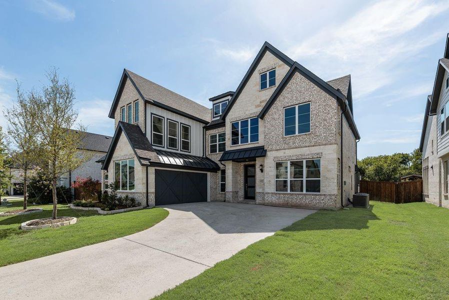 Front exterior of a new home in Breezy Hill, Rockwall, TX, highlighting curb appeal (Image 21). Front exterior of a new home in Breezy Hill, Rockwall, TX, highlighting curb appeal (Image 21).