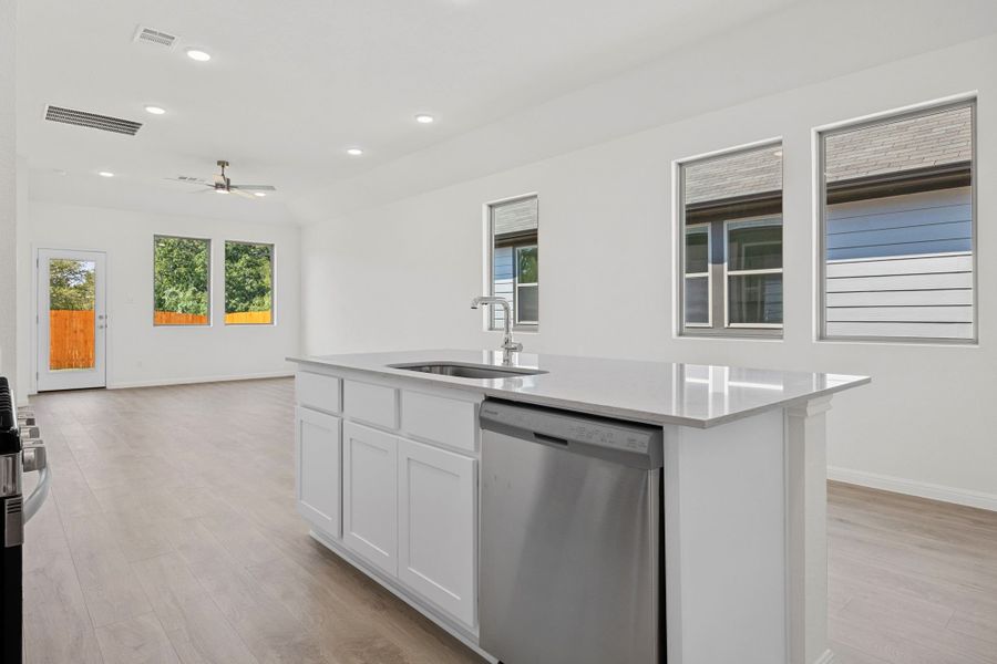 Kitchen in the Elm home plan by Trophy Signature Homes – REPRESENTATIVE PHOTO