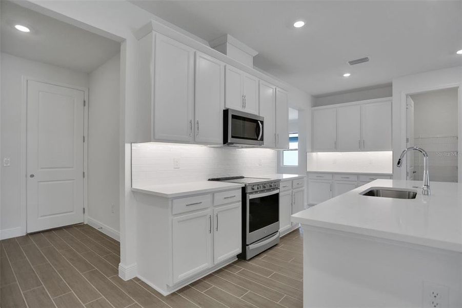 Furnished interior view inside a new home in Seaire, Parrish (Image 10).