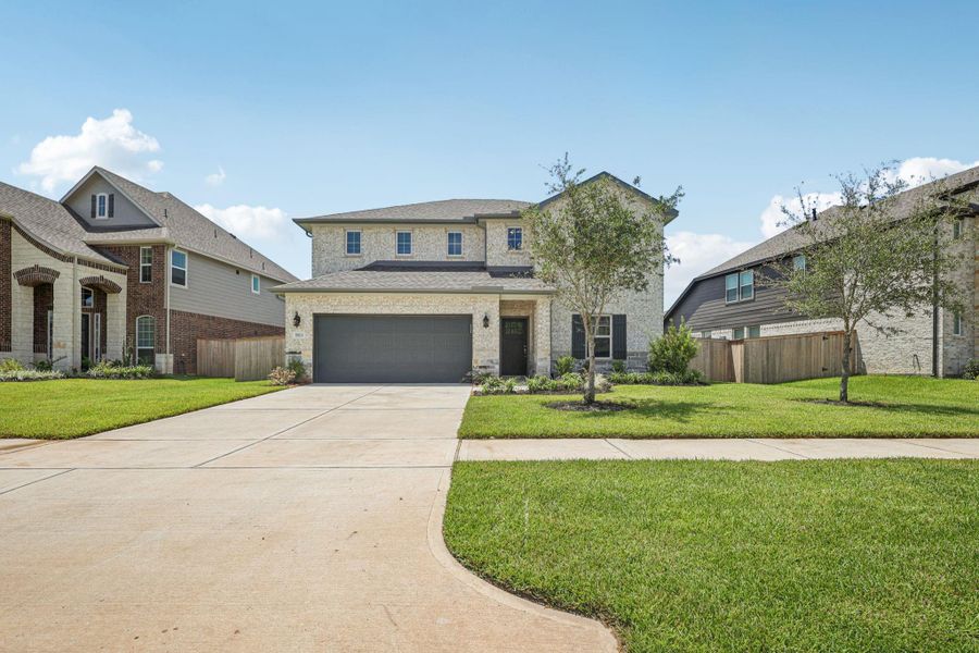 Front exterior of a new home in Kingdom Heights, Rosenberg, TX, highlighting curb appeal (Image 25).