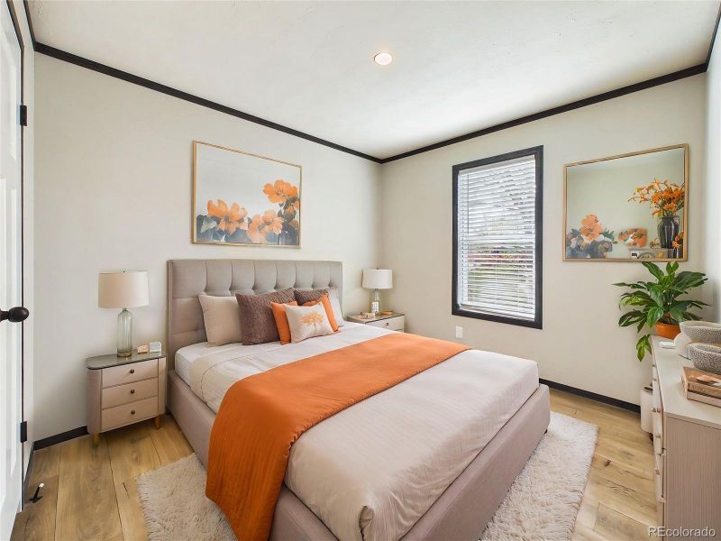 (Virtually Staged) – Comfortable bedroom 2 layout showcasing space for a full furniture set, highlighted by soft natural light and a clean design.