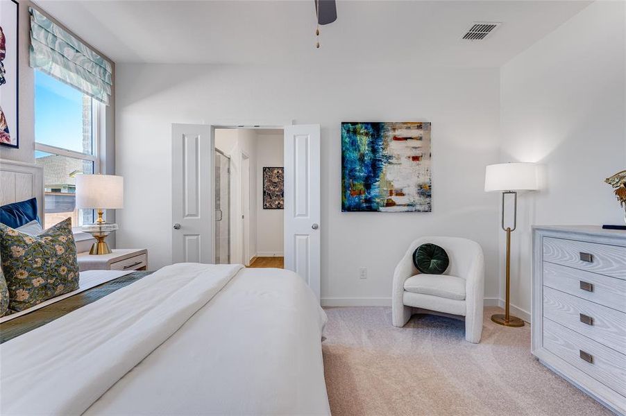 Bedroom featuring ceiling fan and light colored carpet