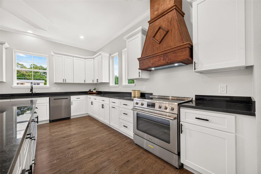 Thoughtfully designed kitchen with plenty of workspace and storage.