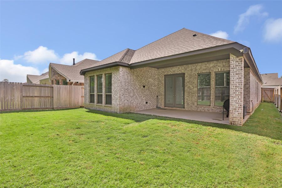 Exterior details and patio area of a home in The Highlands, Porter (Image 28).