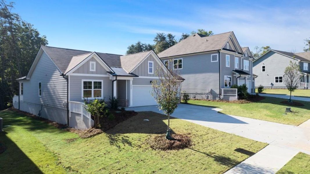 Front exterior of a new home in Falcon Landing, Gainesville, GA, highlighting curb appeal (Image 1).