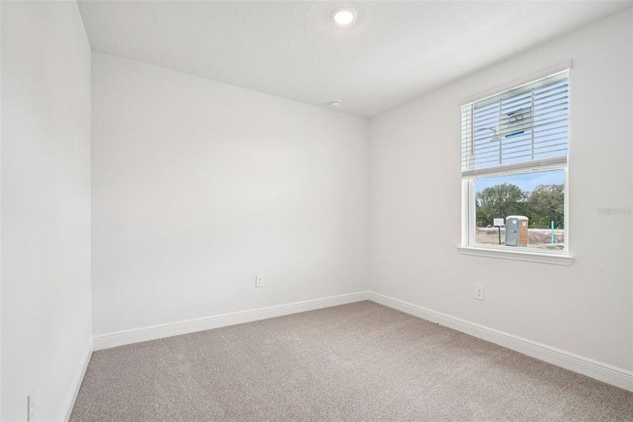 Spacious, unfurnished interior of a new home in The Reserve at Hammock Oaks - Signature Series, Lady Lake (Image 32).