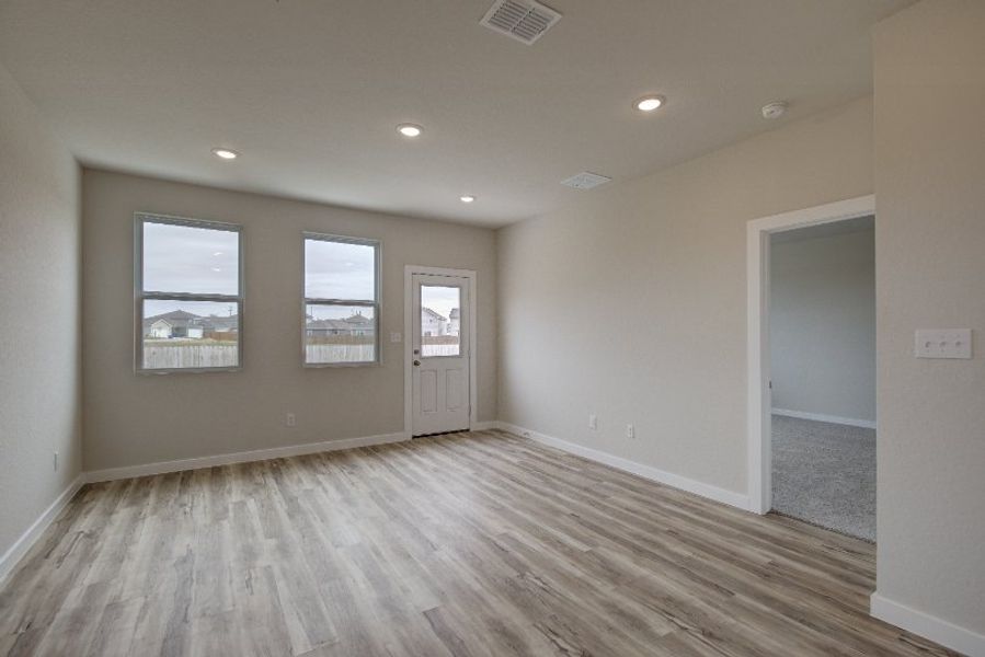 A room with a wood floor and a wood floor. A room with a wood floor and a wood floor.