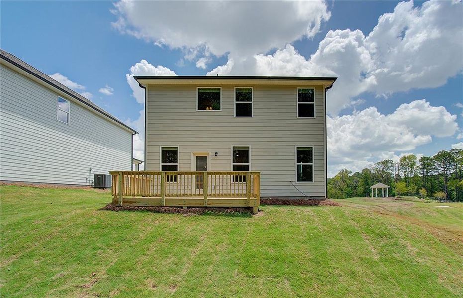 Exterior details and patio area of a home in Enclave at Evergreen, Fairburn (Image 4).