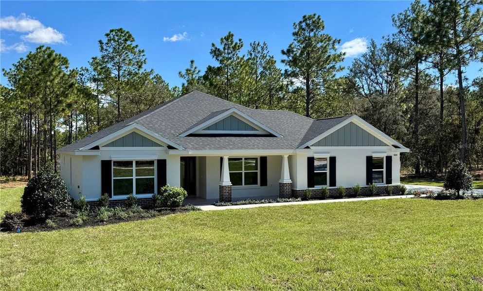 Front exterior of a new home in , Dunnellon, FL, highlighting curb appeal (Image 24). Front exterior of a new home in , Dunnellon, FL, highlighting curb appeal (Image 24).