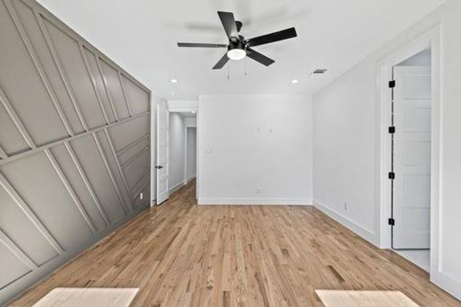 Unfurnished bedroom featuring light hardwood / wood-style flooring and ceiling fan