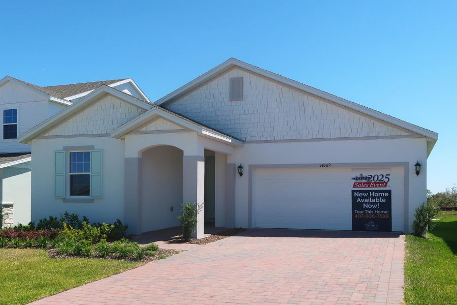 Front exterior of a new home in Ridgeview, Clermont, FL, highlighting curb appeal (Image 28).