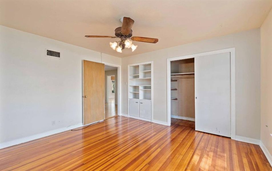 Unfurnished bedroom featuring light wood finished floors and a ceiling fan