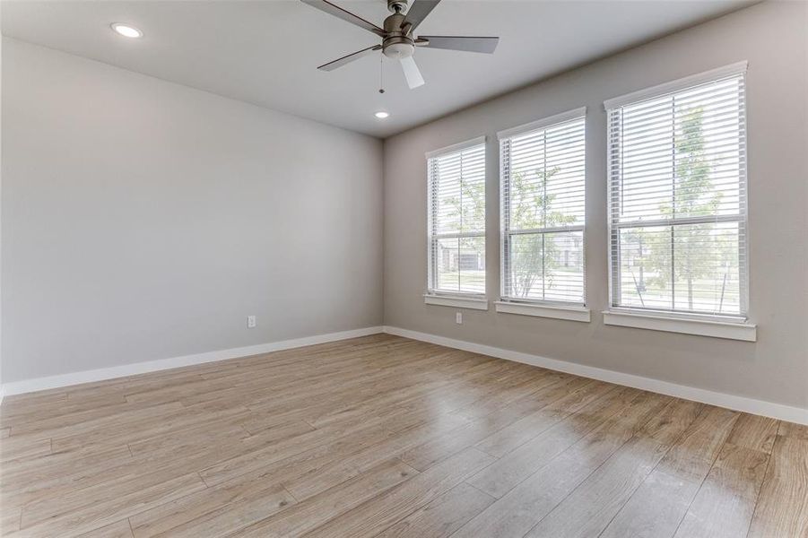 Spare room featuring light hardwood / wood-style floors and ceiling fan