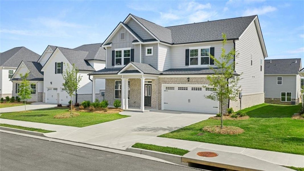 Front exterior of a new home in Wildwood, Covington, GA, highlighting curb appeal (Image 1).