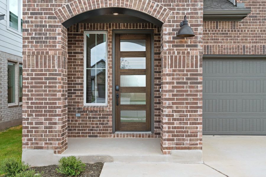 Exterior details and patio area of a home in Lariat, Liberty Hill (Image 3).