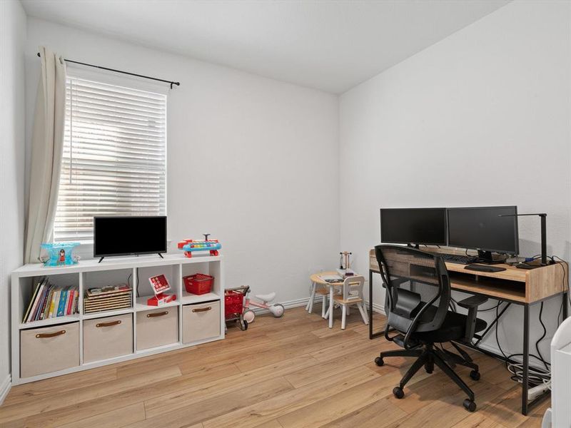 Home office featuring light hardwood / wood-style flooring